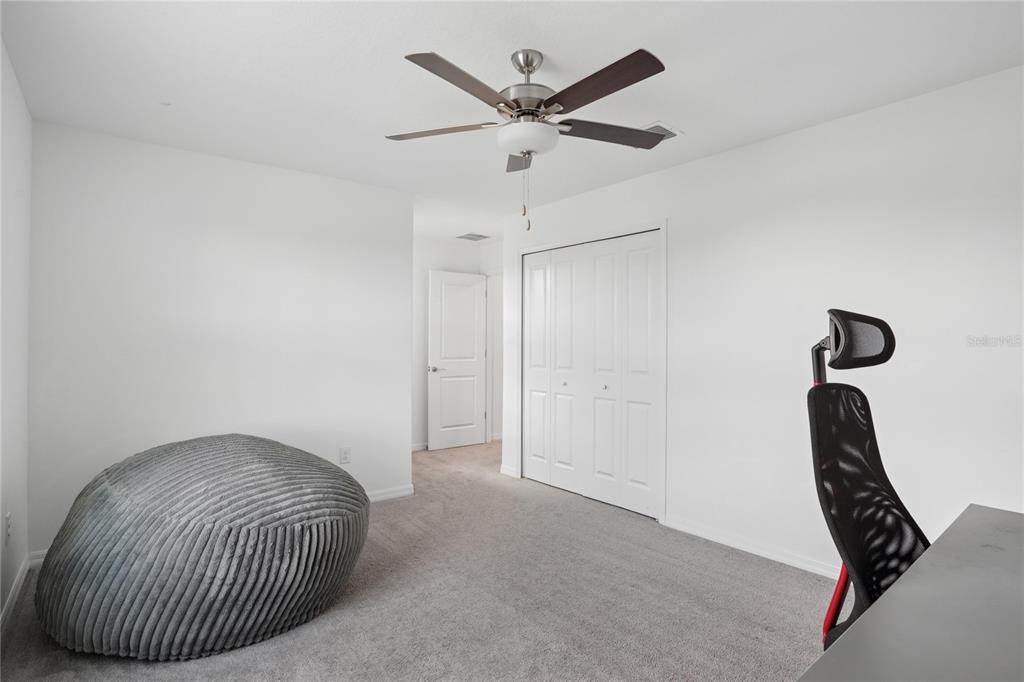 1718 Red Loop Lakeland, FL 33801 - Photo 18 of 25 a bedroom with a bed and window