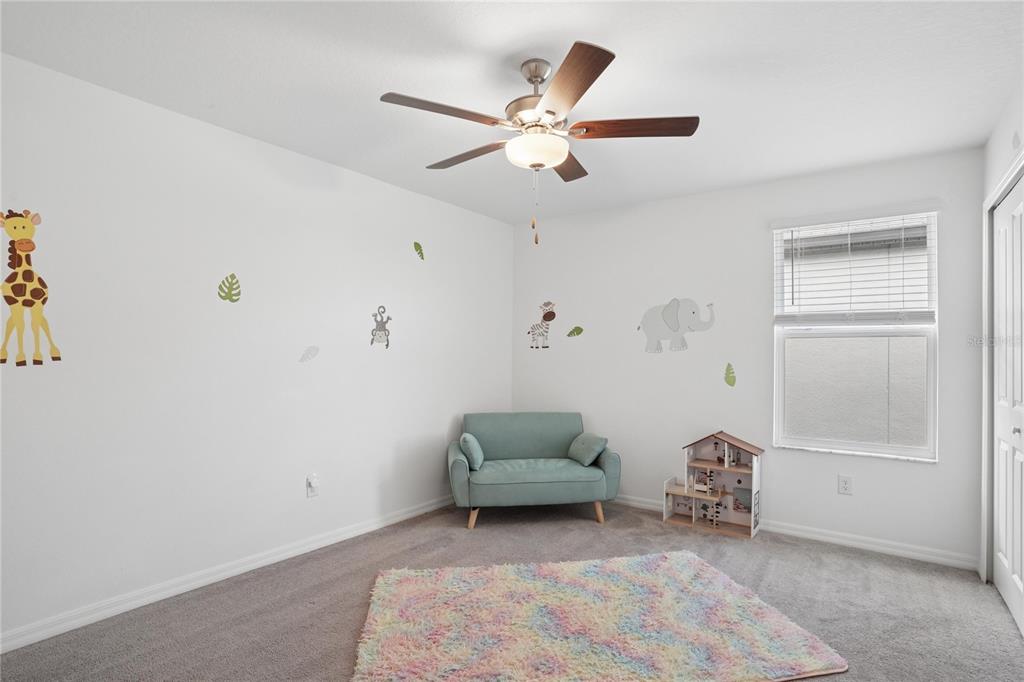 1718 Red Loop Lakeland, FL 33801 - Photo 19 of 25 a living room with furniture and a ceiling fan