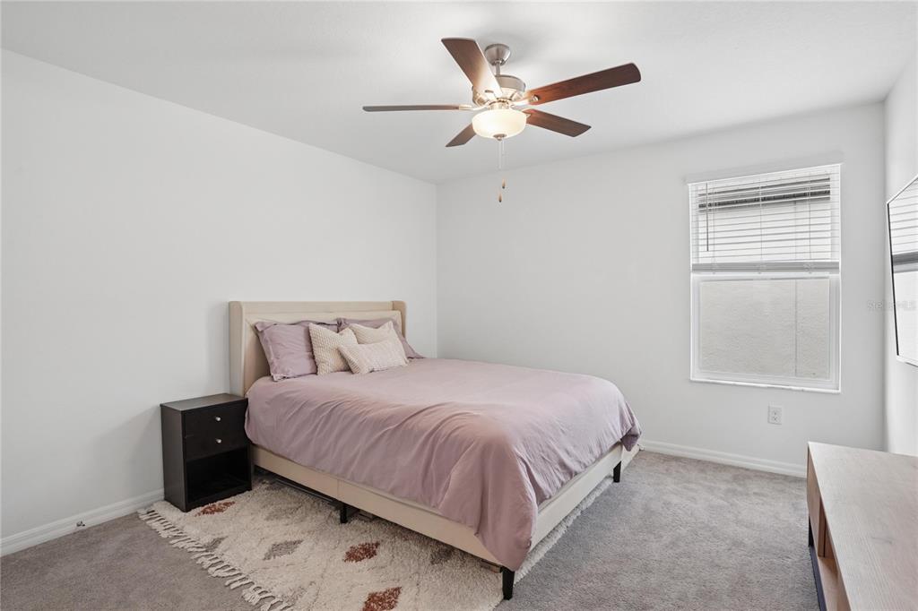 1718 Red Loop Lakeland, FL 33801 - Photo 21 of 25 a bedroom with a bed and a window