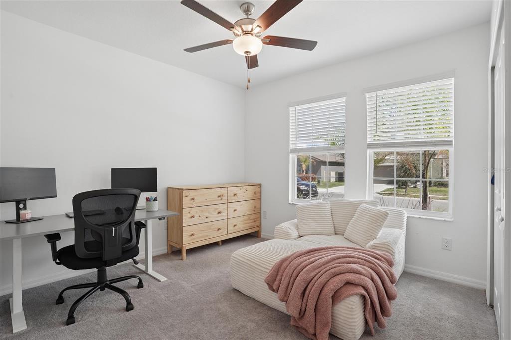 1718 Red Loop Lakeland, FL 33801 - Photo 4 of 25 a bedroom with a workspace