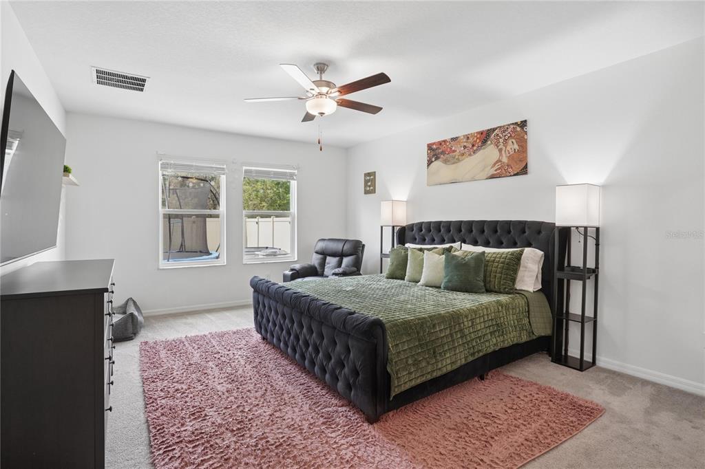 1718 Red Loop Lakeland, FL 33801 - Photo 6 of 25 a bedroom with a bed and a window