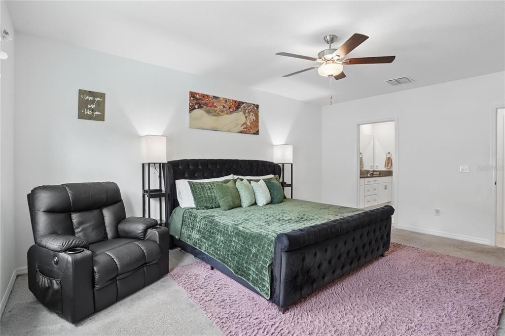 1718 Red Loop Lakeland, FL 33801 - Photo 7 of 25 a bedroom with a bed couch and window