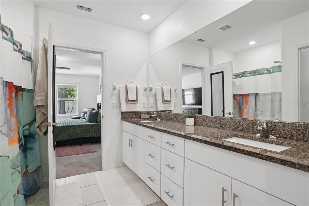 1718 Red Loop Lakeland, FL 33801 - Photo 8 of 25 a spacious en suite bathroom with a double sink and mirror