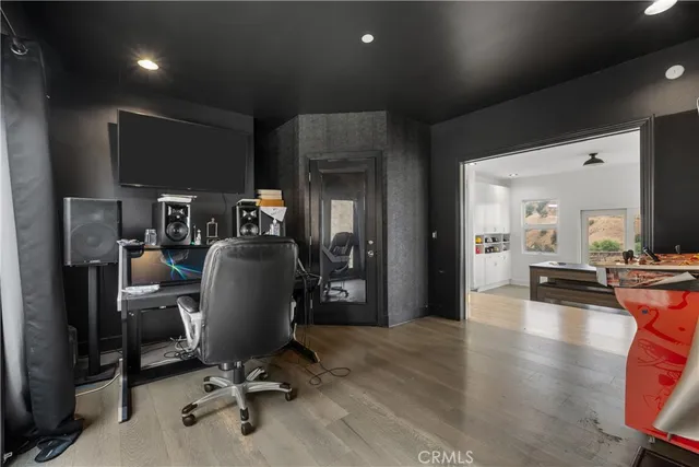 a bedroom with a bed chair and a large window