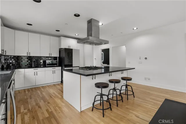 a bedroom with furniture and a large window