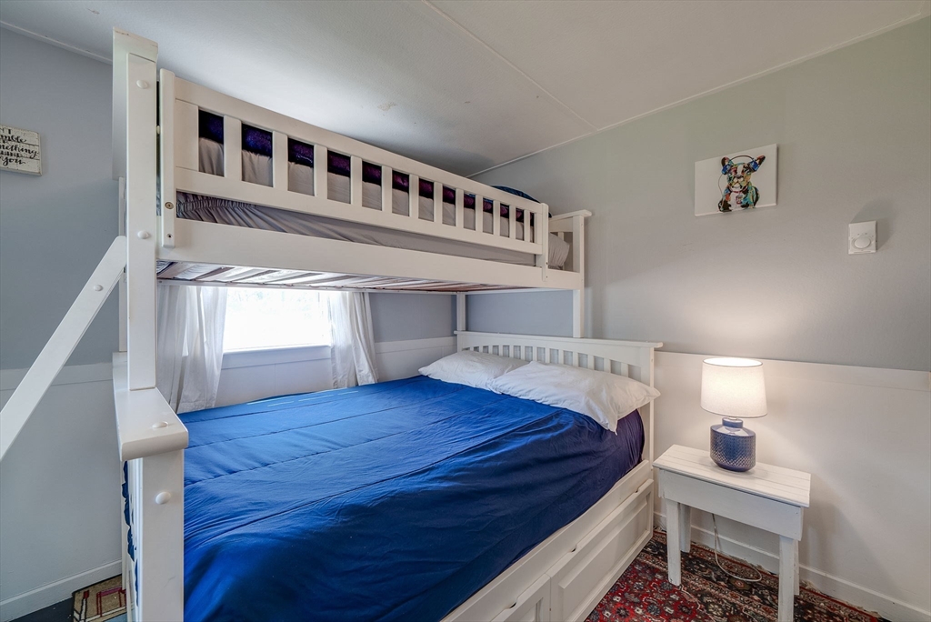 18 Smith Road Rockport, MA 01966 - Photo 16 of 28 a bedroom with a bed and a window