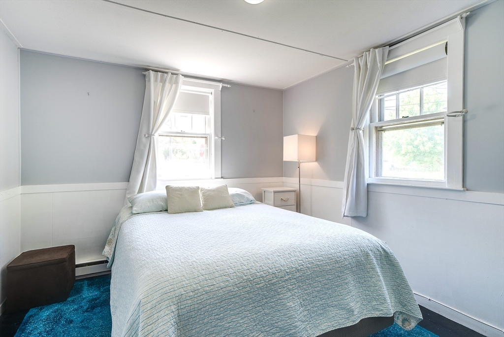 18 Smith Road Rockport, MA 01966 - Photo 17 of 28 a bedroom with a bed and a window