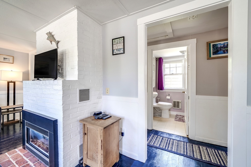 18 Smith Road Rockport, MA 01966 - Photo 18 of 28 a living room with furniture and a flat screen tv