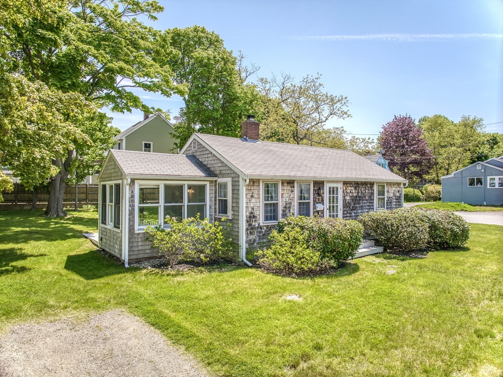 18 Smith Road Rockport, MA 01966 - Photo 3 of 28 a front view of a house with garden