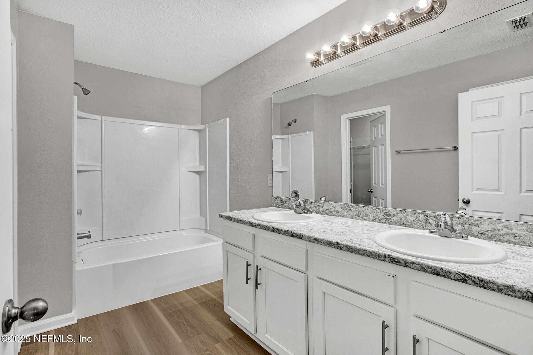 10632 Tulsa Road Jacksonville, FL 32218 - Photo 14 of 25 a bathroom with a sink double vanity granite tub and shower