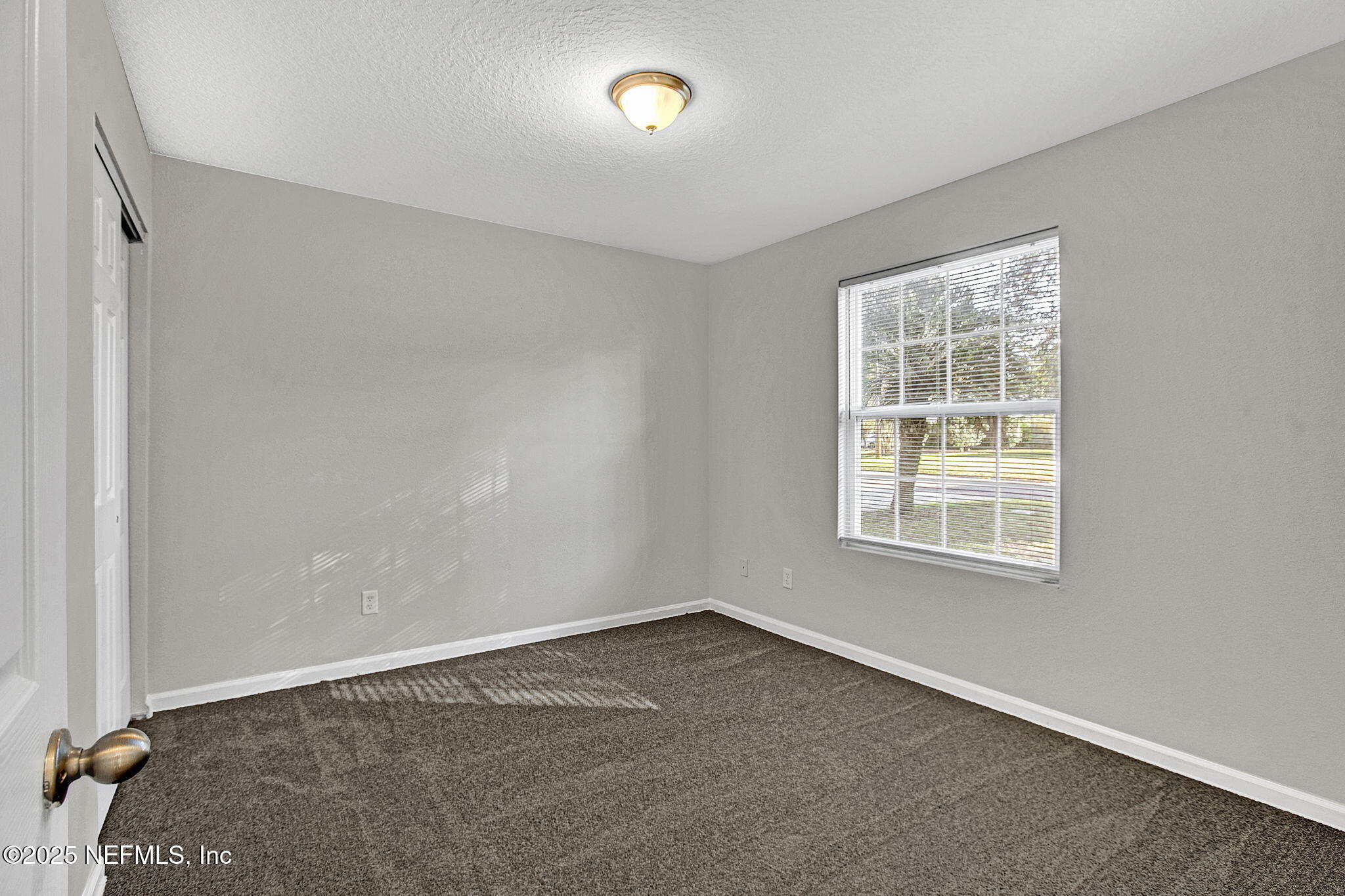 10632 Tulsa Road Jacksonville, FL 32218 - Photo 16 of 25 an empty room with a empty space and a window