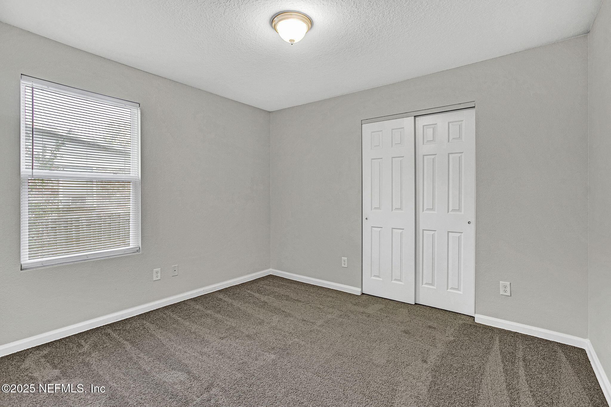 10632 Tulsa Road Jacksonville, FL 32218 - Photo 18 of 25 a view of an empty room with a window