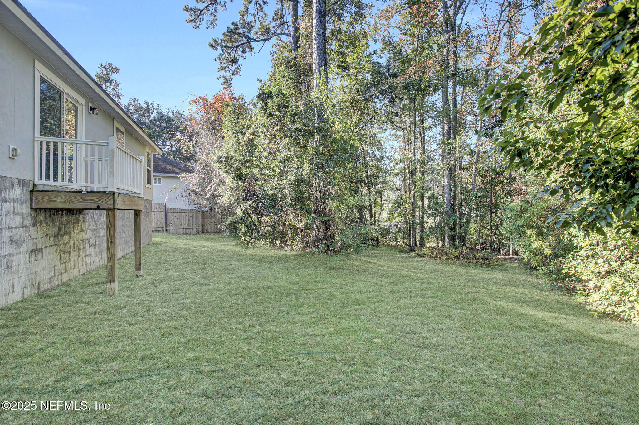 10632 Tulsa Road Jacksonville, FL 32218 - Photo 24 of 25 a view of a backyard with large trees