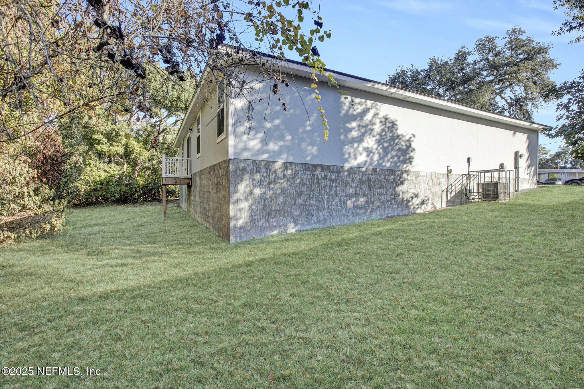 10632 Tulsa Road Jacksonville, FL 32218 - Photo 25 of 25 a view of a yard with a house in the background