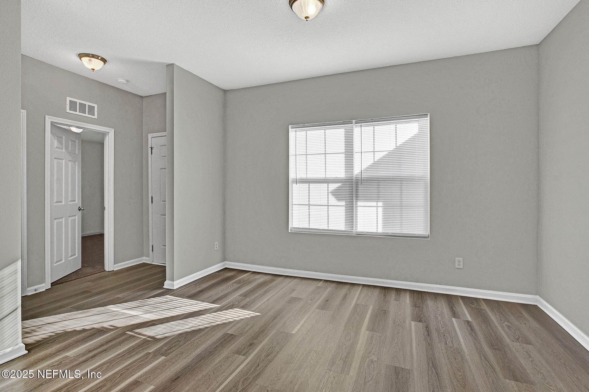 10632 Tulsa Road Jacksonville, FL 32218 - Photo 3 of 25 a view of an empty room and window