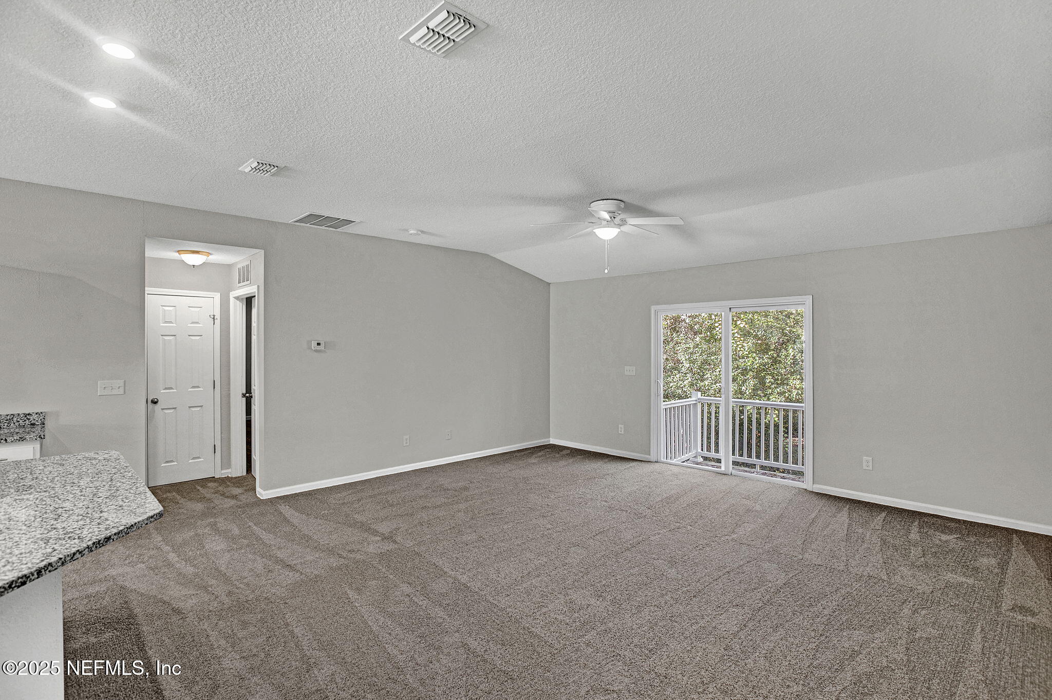 10632 Tulsa Road Jacksonville, FL 32218 - Photo 10 of 25 an empty room with windows and closet