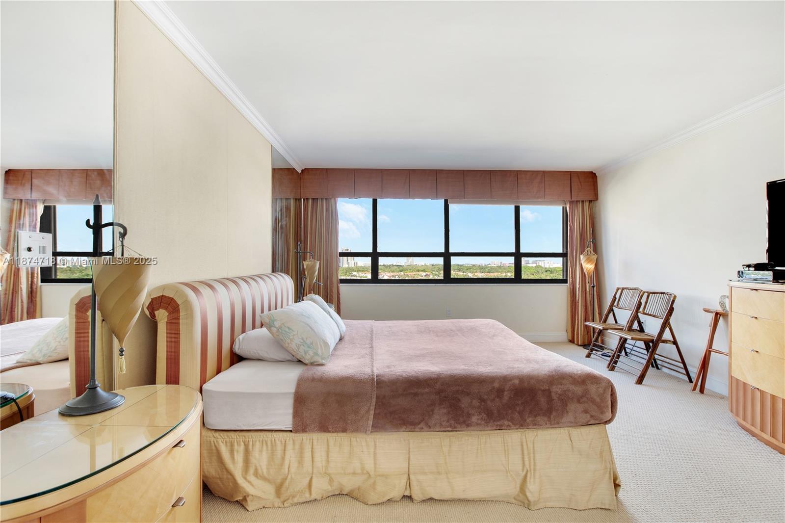 3 Grove Isle Drive, Unit C1108 Miami, FL 33133 - Photo 11 of 30 a bedroom with bed and a large window