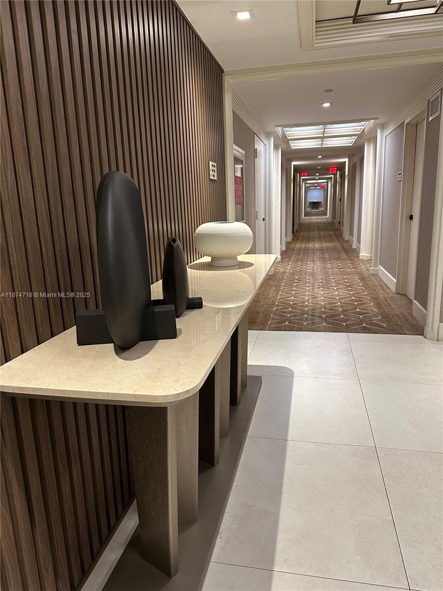 3 Grove Isle Drive, Unit C1108 Miami, FL 33133 - Photo 20 of 30 a kitchen with a sink window and chairs