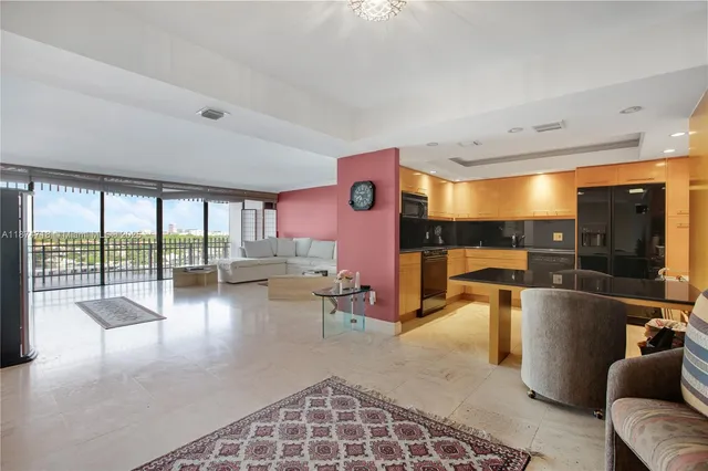 a view of a living room and a balcony