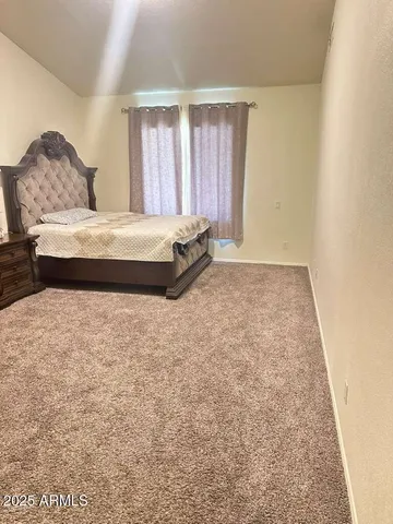 a bathroom with a granite countertop sink a toilet and a bathtub