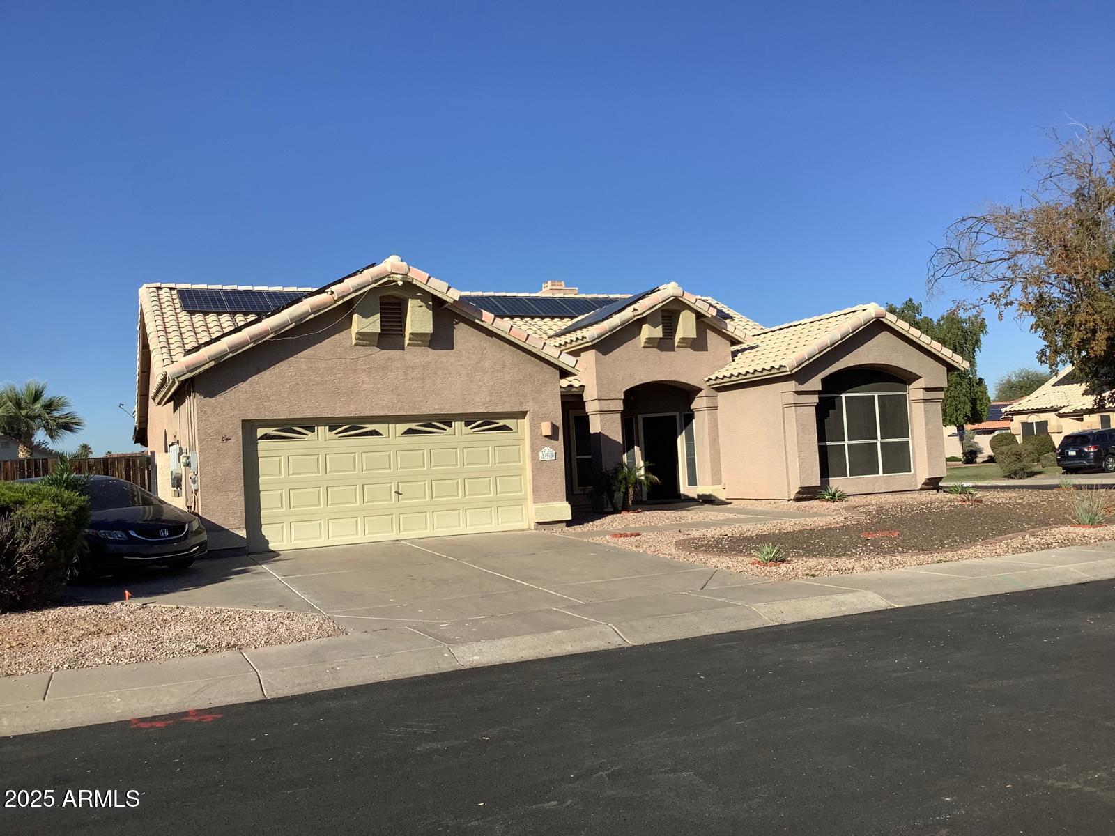 590 South Neely Street Gilbert, AZ 85233 - Photo 2 of 21 a front view of a house with a yard