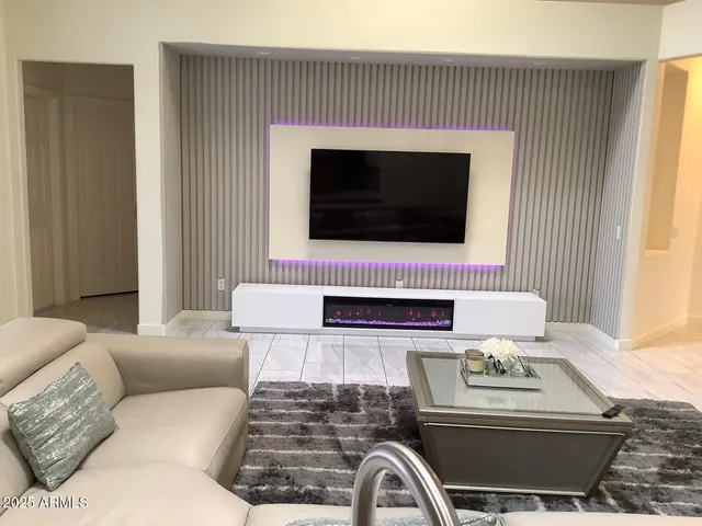 a living room with a couch and a flat screen tv