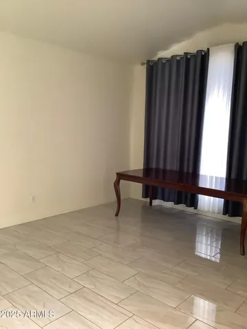 a view of a room with a large window