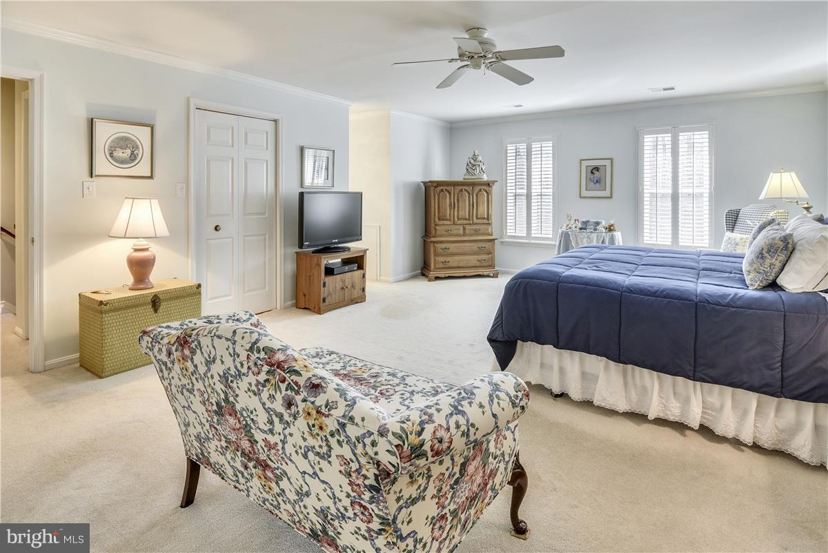 2833 Rifle Ridge Road Oakton, VA 22124 - Photo 11 of 30 Master Bedroom with Walk-in Closet and Ceiling Fan