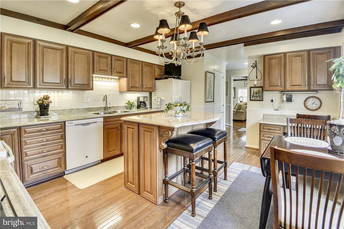 2833 Rifle Ridge Road Oakton, VA 22124 - Photo 6 of 30 Upgraded Kitchen with Island and Chandelier
