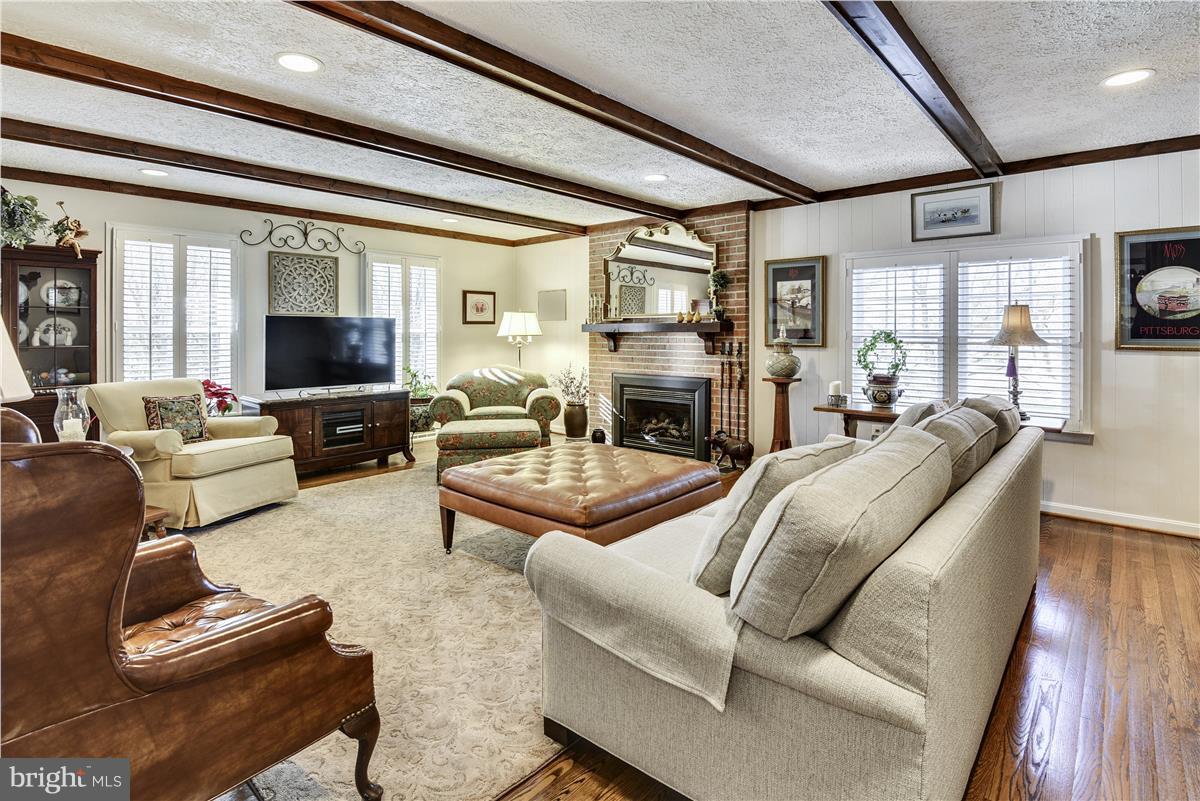 2833 Rifle Ridge Road Oakton, VA 22124 - Photo 7 of 30 Family Room with Hardwood Floors and Gas Fireplace