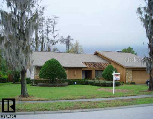 385 Holly Hill Road Oldsmar, FL 34677 - Photo 1 of 1 a front view of a house with a yard
