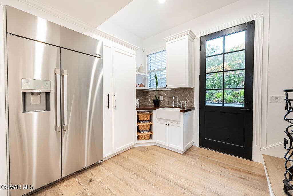 508 West Stafford Road Thousand Oaks, CA 91361 - Photo 15 of 35 a kitchen with stainless steel appliances a refrigerator sink and cabinets