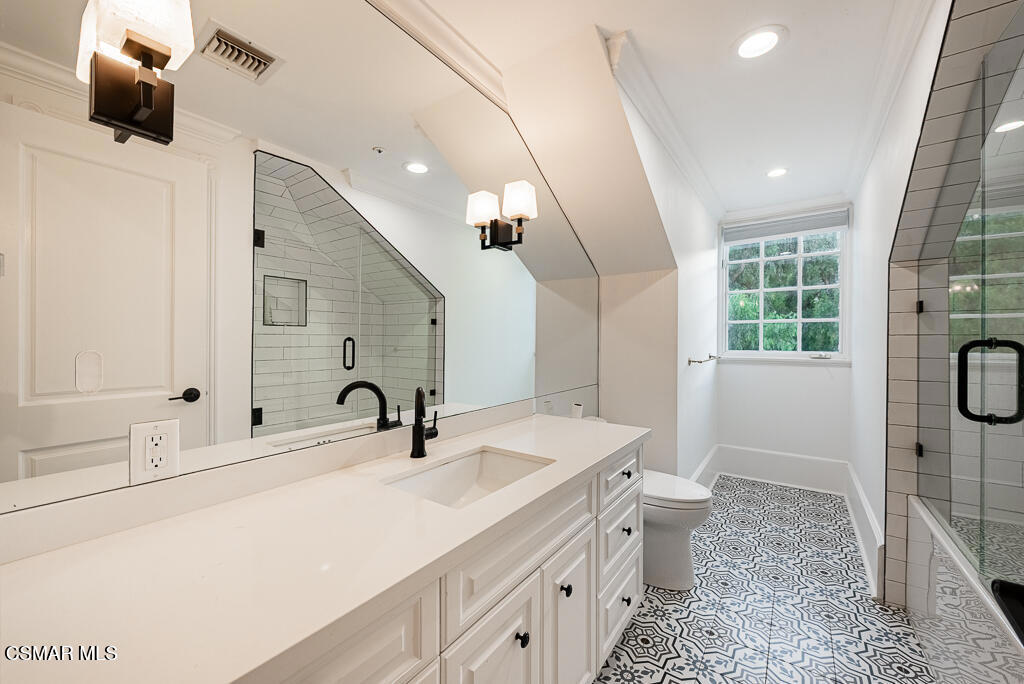 508 West Stafford Road Thousand Oaks, CA 91361 - Photo 18 of 35 a bathroom with a sink a toilet a mirror and shower