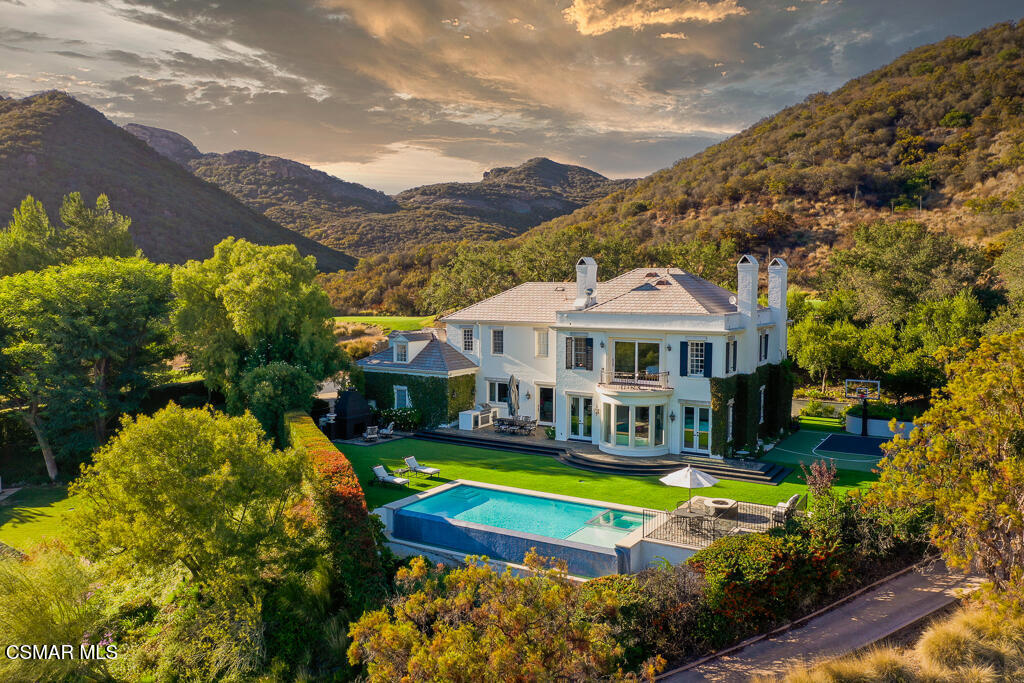 508 West Stafford Road Thousand Oaks, CA 91361 - Photo 31 of 35 a view of a house with a big yard and large trees