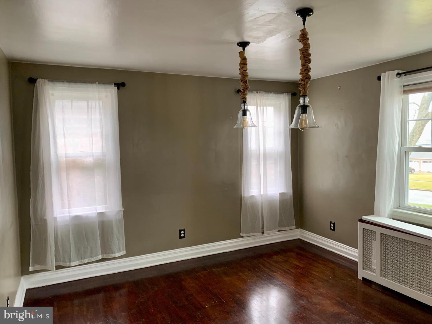 30 Upper Ferry Road Ewing, NJ 08628 - Photo 3 of 12 a view of empty room with wooden floor and fan