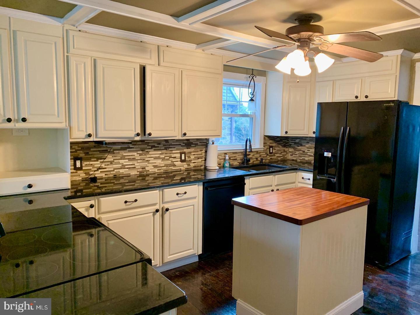 30 Upper Ferry Road Ewing, NJ 08628 - Photo 4 of 12 a kitchen with stainless steel appliances granite countertop a refrigerator a sink dishwasher a stove and white cabinets with wooden floor