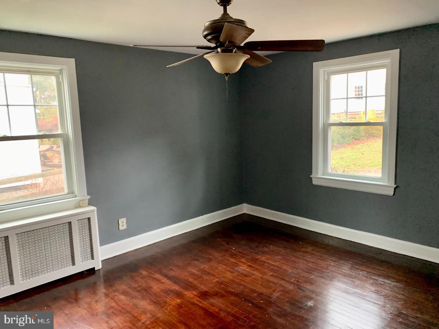 30 Upper Ferry Road Ewing, NJ 08628 - Photo 7 of 12 a view of an empty room with wooden floor and a window