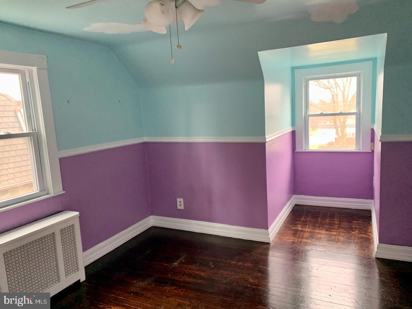 30 Upper Ferry Road Ewing, NJ 08628 - Photo 9 of 12 a view of an empty room with wooden floor and a window