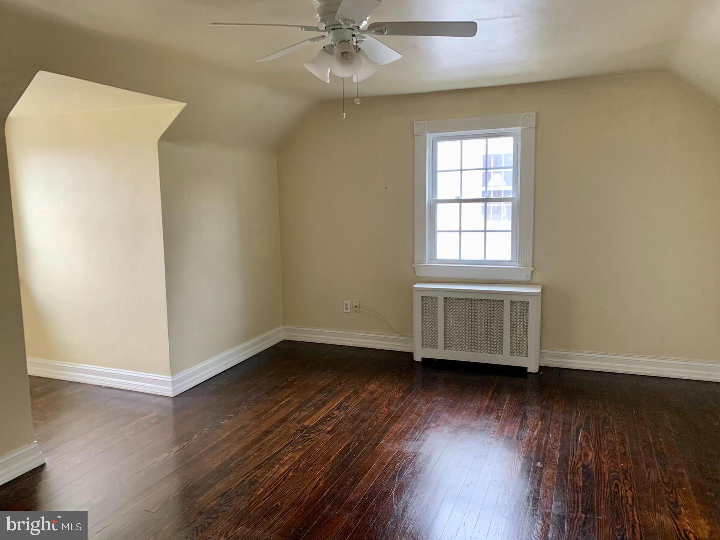 30 Upper Ferry Road Ewing, NJ 08628 - Photo 10 of 12 an empty room with wooden floor fan and windows