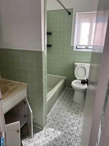 a bathroom with a sink a toilet and a bathtub