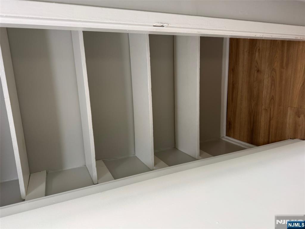 340 Hudson Street, Unit 44 Hackensack, NJ 07601 - Photo 4 of 8 a view of walk in closet with empty racks