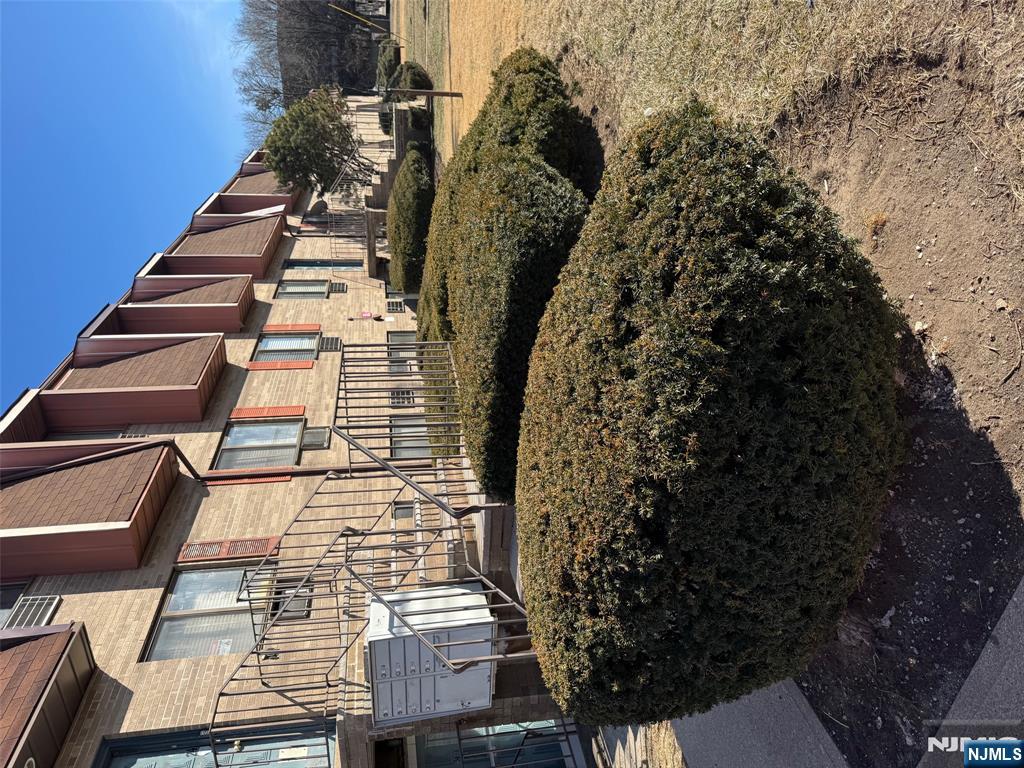 340 Hudson Street, Unit 44 Hackensack, NJ 07601 - Photo 8 of 8 a view of a house with a yard