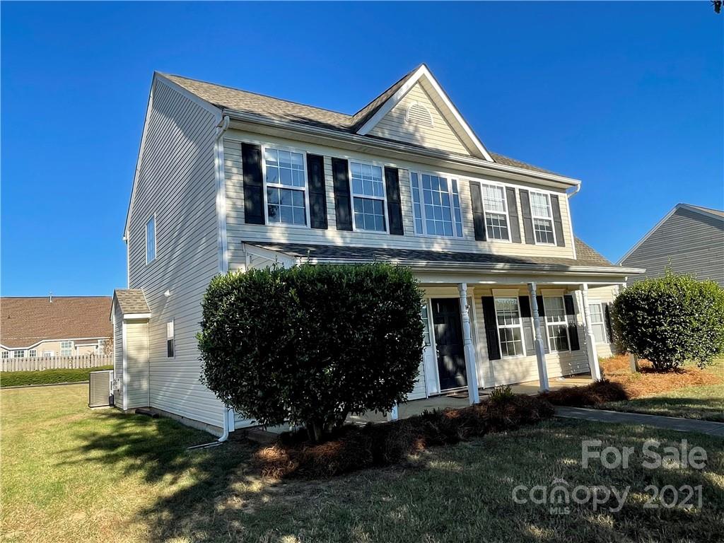 5514 Rogers Road Indian Trail, NC 28079 - Photo 2 of 34 a front view of a house with a garden