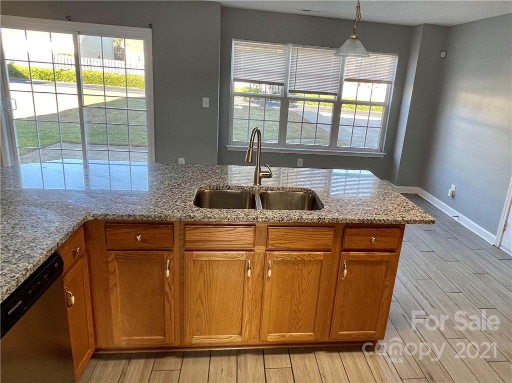 5514 Rogers Road Indian Trail, NC 28079 - Photo 12 of 34 a kitchen with granite countertop cabinets and window