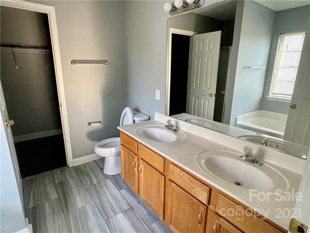 5514 Rogers Road Indian Trail, NC 28079 - Photo 21 of 34 a bathroom with a sink toilet and shower