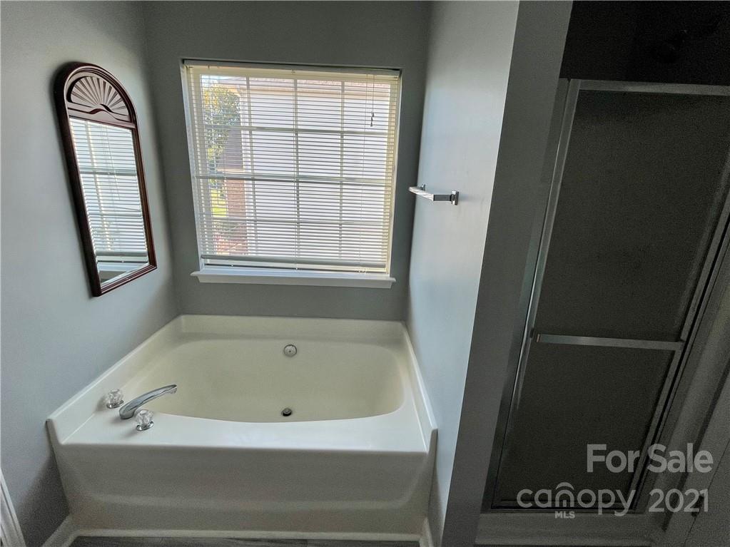 5514 Rogers Road Indian Trail, NC 28079 - Photo 23 of 34 a bathroom with a bathtub