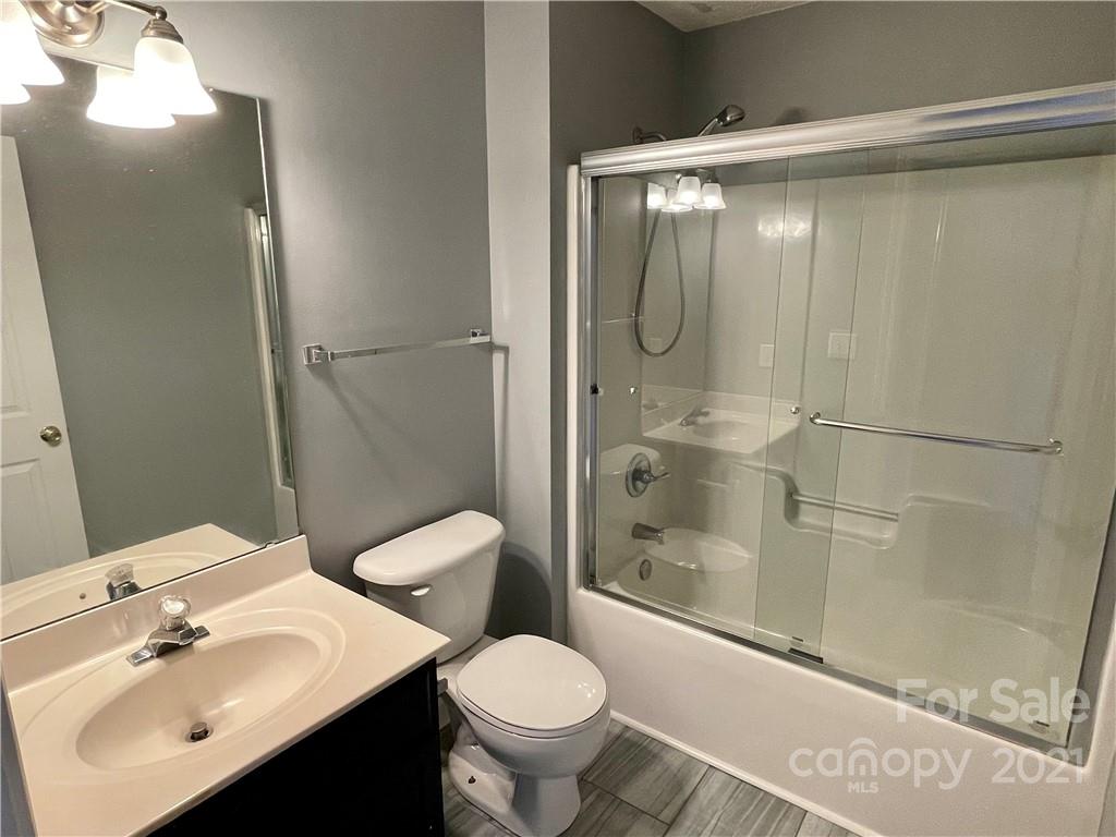5514 Rogers Road Indian Trail, NC 28079 - Photo 27 of 34 a bathroom with a sink toilet and shower