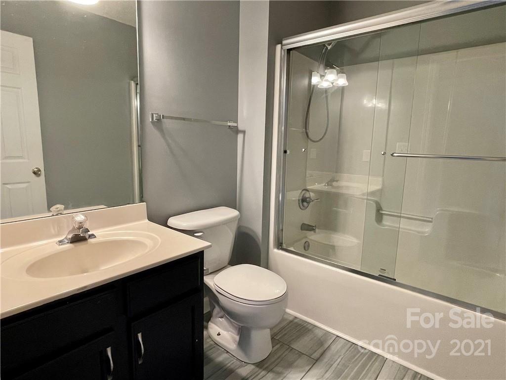 5514 Rogers Road Indian Trail, NC 28079 - Photo 28 of 34 a bathroom with a sink a toilet and shower