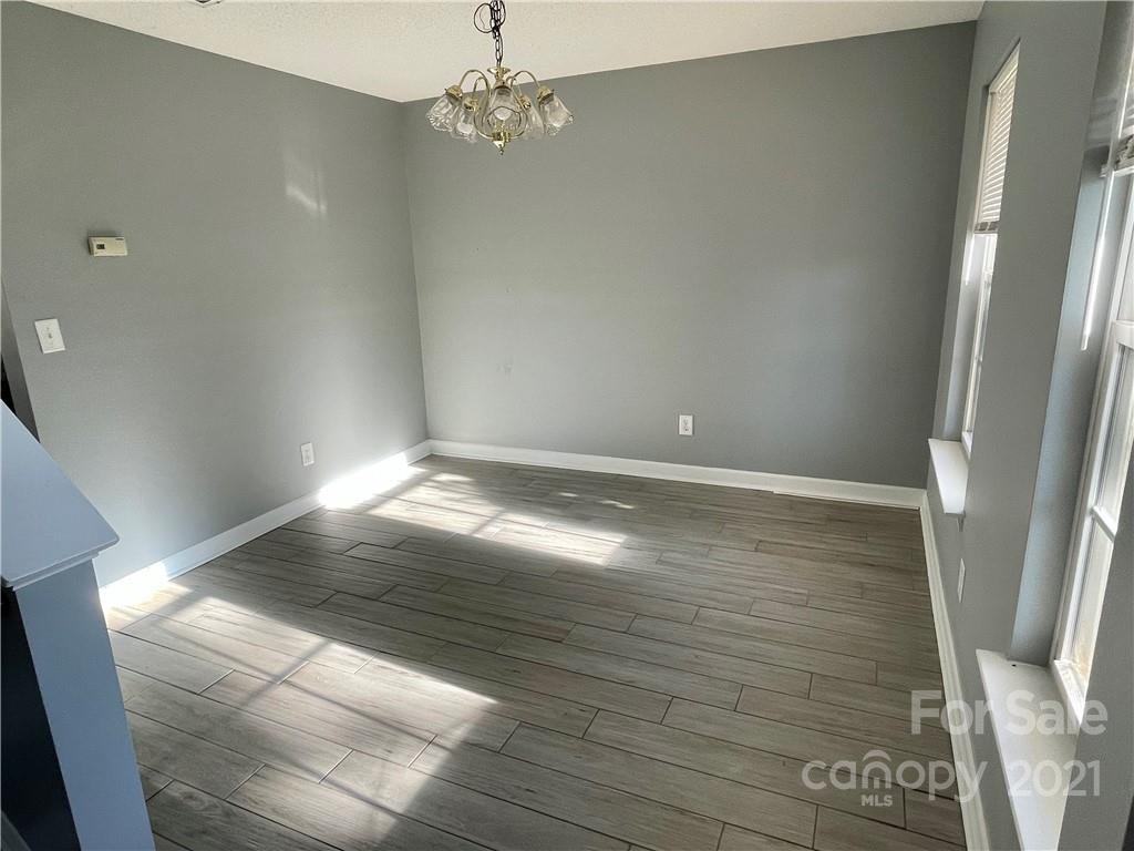 5514 Rogers Road Indian Trail, NC 28079 - Photo 4 of 34 en empty room with wooden floor and window