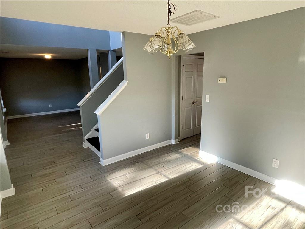 5514 Rogers Road Indian Trail, NC 28079 - Photo 5 of 34 a view of livingroom and kitchen with wooden floor